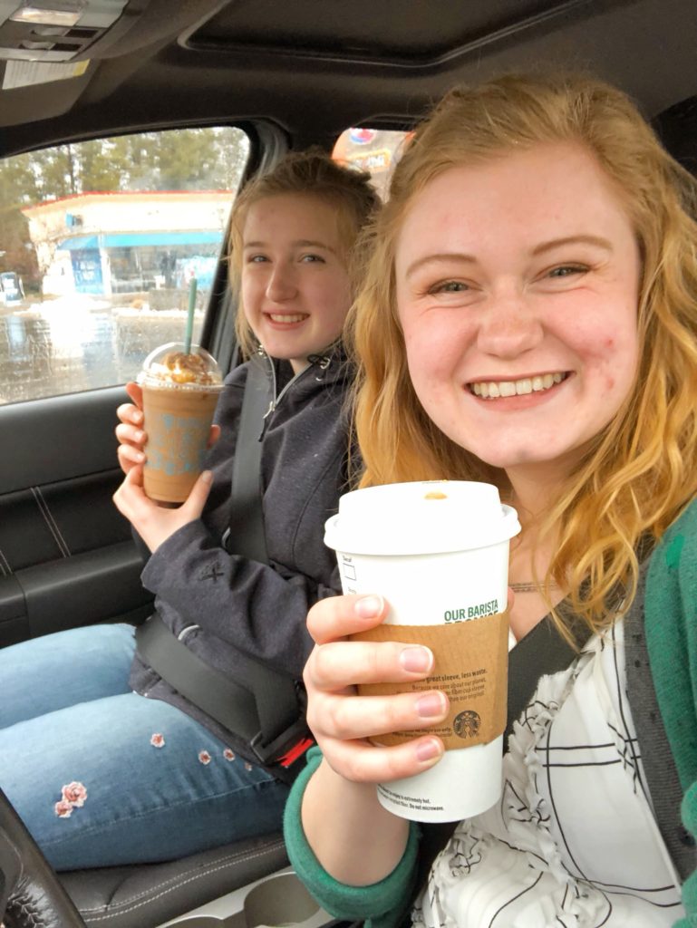 Hannah and Meg with two free coffees